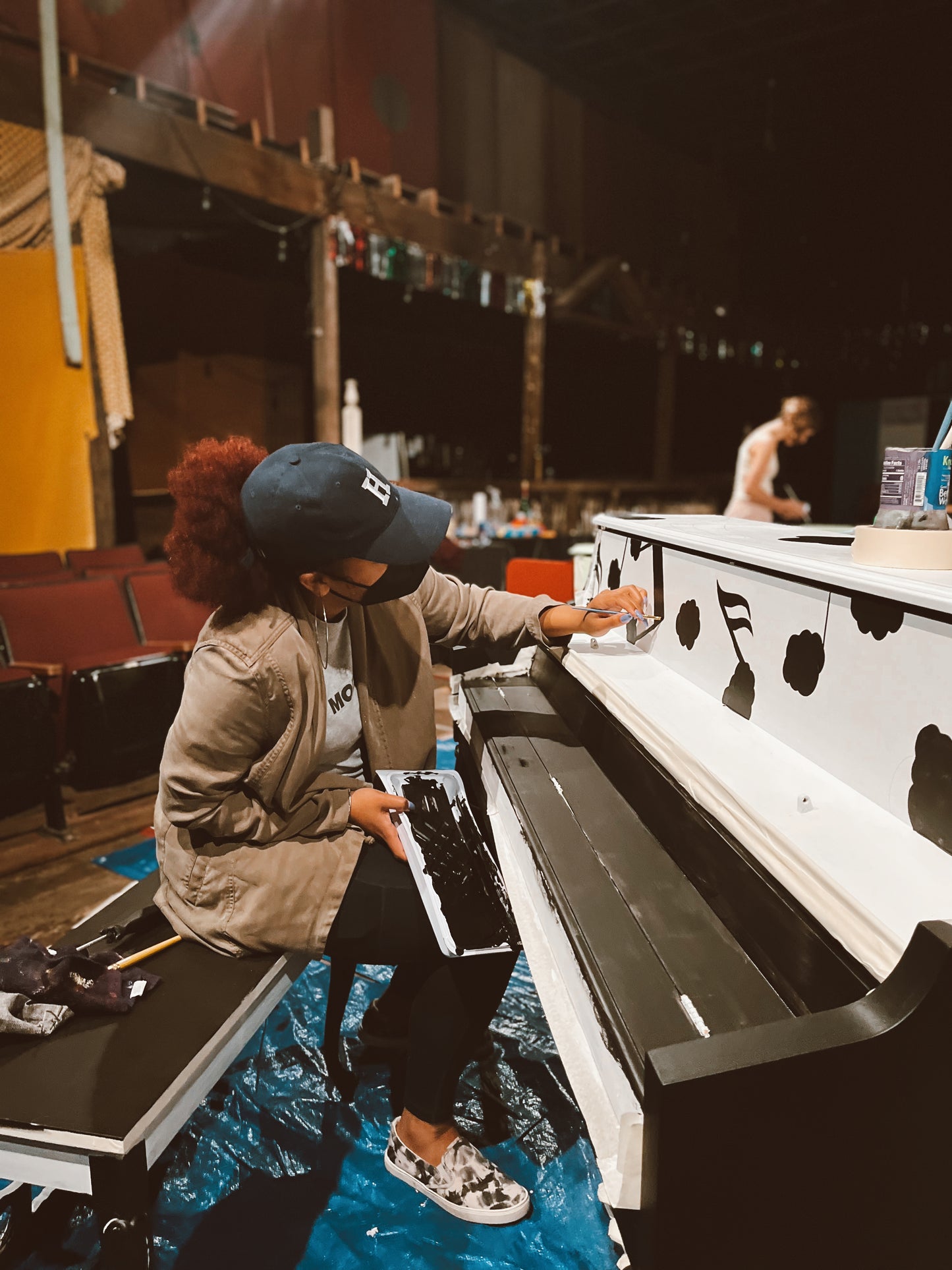 Photo by The Fennell Focus - Artist Micheala Angelena painting a piano for the non-profits Sing for Hope and Pianola.